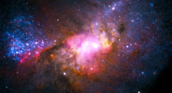 Astronomers solve mystery behind starburst galaxy M82