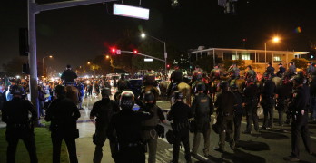 Costa Mesa, CA - April 28, 2016: Protesters of republican presidential candidate Donald Trump, Riot in the streets while the police control the crowd and make arrest  at a rally at the Costa Mesa CA.