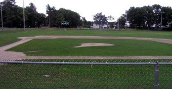 Empty Little League baseball field after the last game of the season