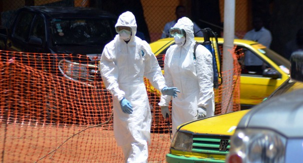 Panic in Ebola-stricken Sierra Leone as police fire tear gas on crowd during lockdown
