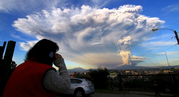Spectacular plume of ash blasted from volcano in Chile, causing evacuations and flight cancellations