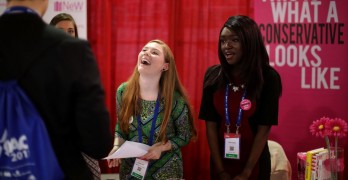 NATIONAL HARBOR, MD - FEBRUARY 23:  Young people man the Network of Enlightened Women table in the Exhibitor Hub during the first day of the Conservative Political Action Conference at the Gaylord National Resort and Convention Center February 23, 2017 in National Harbor, Maryland. Hosted by the American Conservative Union, CPAC is an annual gathering of right wing politicians, commentators and their supporters.  (Photo by Chip Somodevilla/Getty Images)