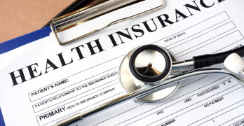 Health insurance form with stethoscope. insurance concept
