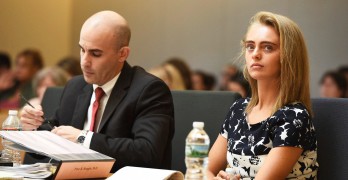 Defense Attorney Cory Madera makes notes as defendant Michelle Carter listens with attorney Joseph Cataldo (not shown) during her trial at Taunton Juvenile Court in Taunton, Mass., Monday, June 12, 2017. Carter is charged with involuntary manslaughter for encouraging Conrad Roy III to kill himself in July 2014. (Faith Ninivaggi/The Boston Herald via AP, Pool)
